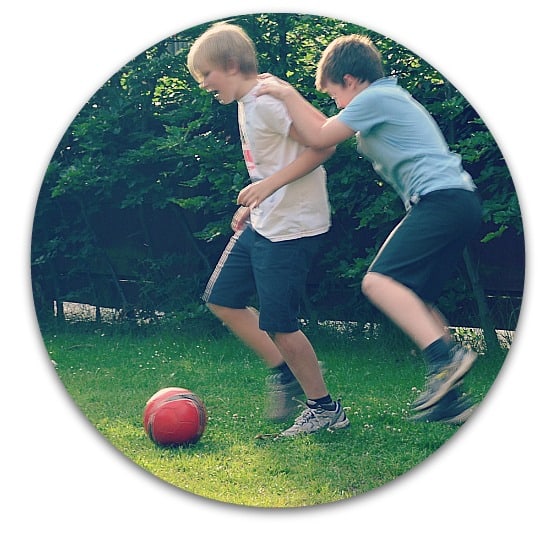 boys playing football