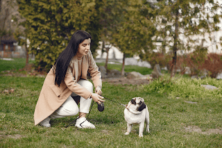A woman walking her dog